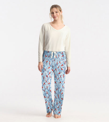 Cream long sleeve t-shirt with a v-neck and pocket, paired with patterned blue pajama pants featuring red birds.