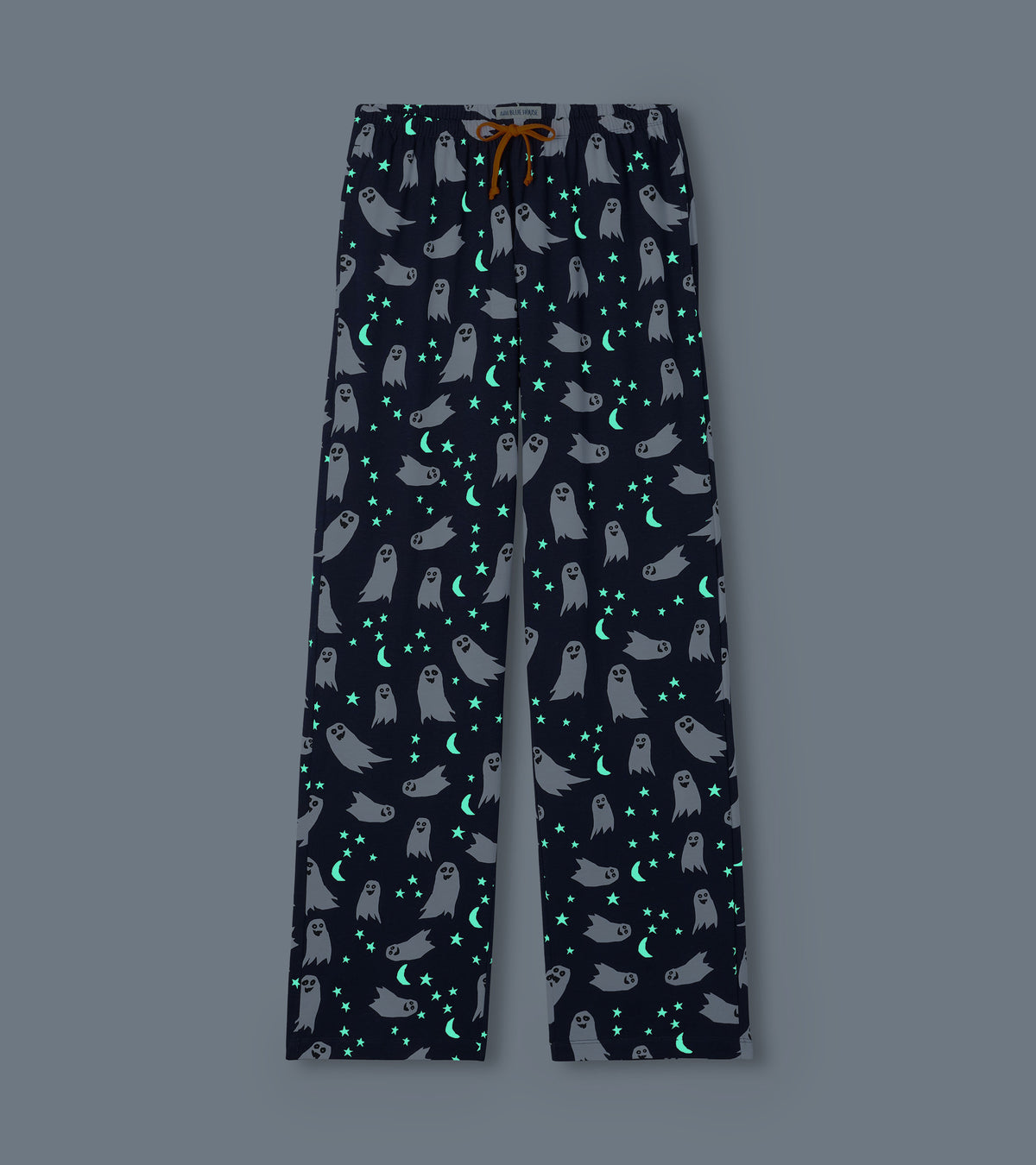 Navy ghost-print pajama pants with glowing stars and crescent moons on a dark background