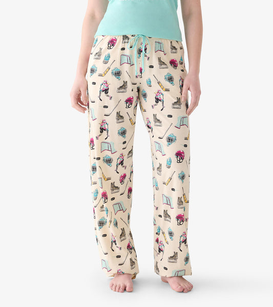 Close view of women's pajama pants with hockey print and aqua drawstring waist