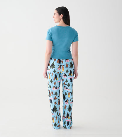 Back view of women's light blue pajama pants with woodland animal, tree and campfire print