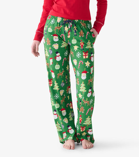Close-up of green Christmas pajama pants with drawstring waist and festive holiday icon print