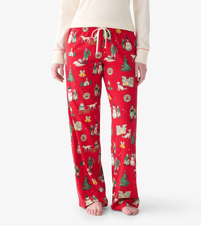 Front view of red Christmas pajama pants with drawstring waist and vintage holiday scene print