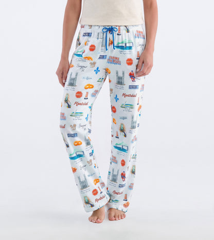 Front view of white Montreal pajama pants with blue drawstring and city-themed print