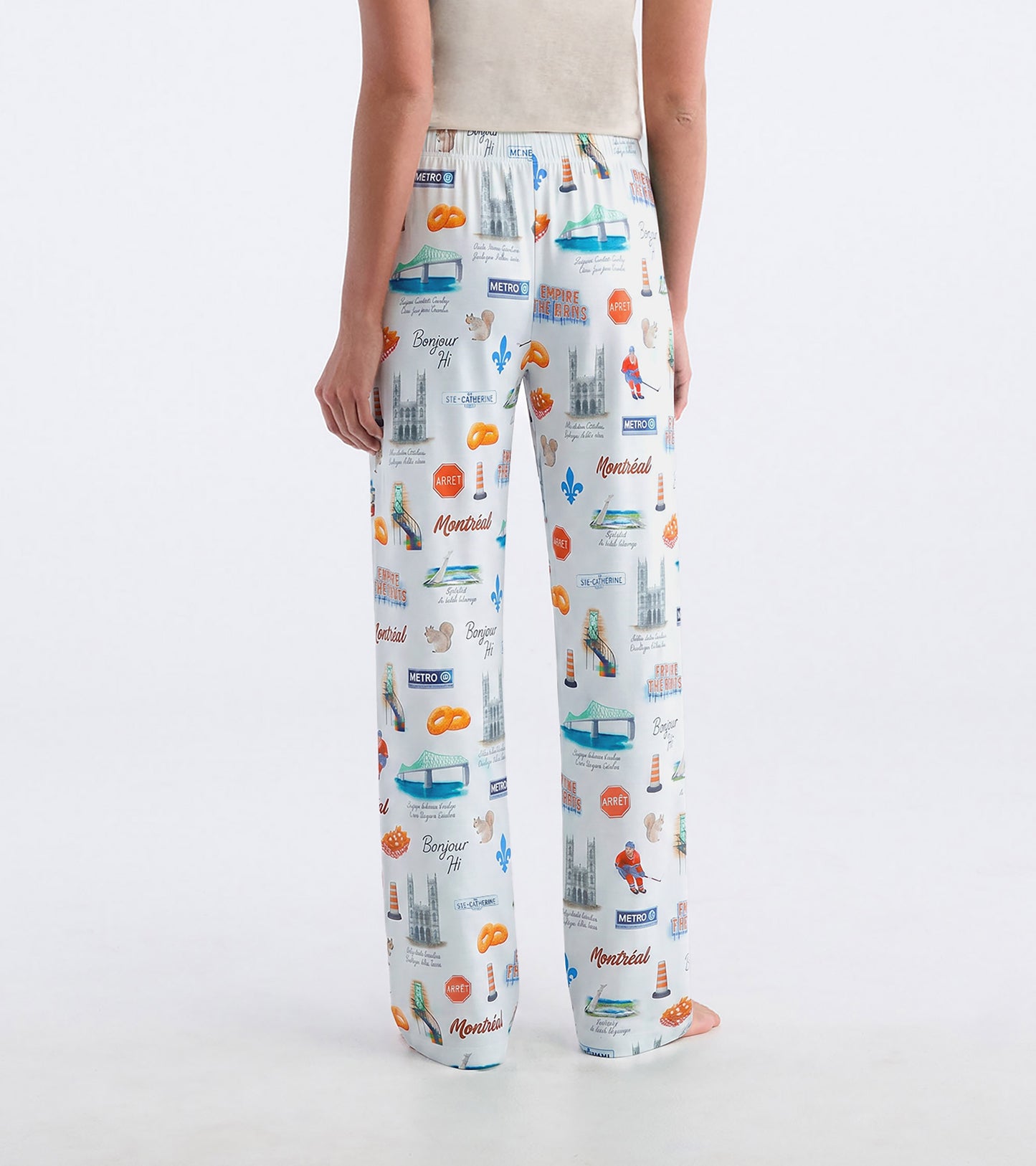 Back view of white Montreal pajama pants with colorful city-themed print