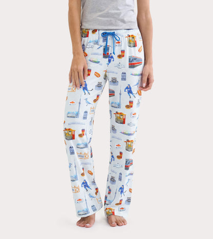 Front view of women's white pajama pants with blue drawstring and colorful Toronto landmark print