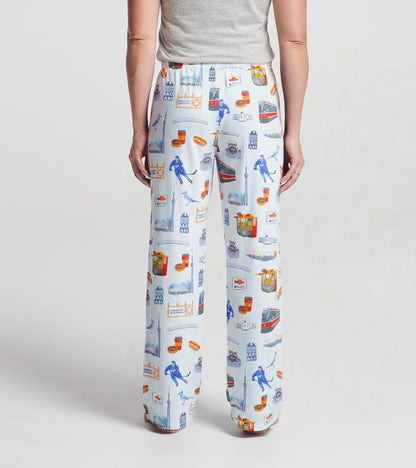 Back view of women's white pajama pants with colorful Toronto landmark and streetcar print