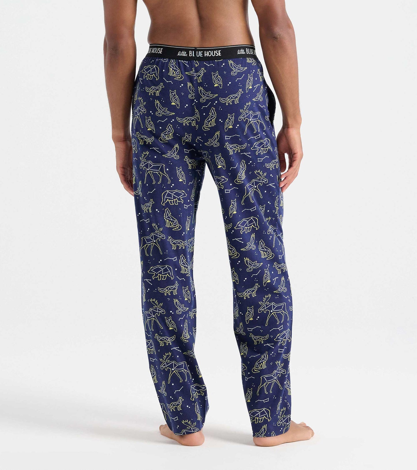 Back view of navy pajama pants with animal constellation print and black Little Blue House waistband