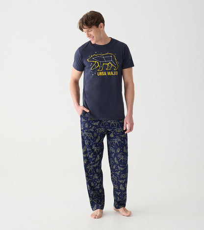 Model wearing navy animal constellation pajama pants with an Ursa Major graphic T-shirt, front view