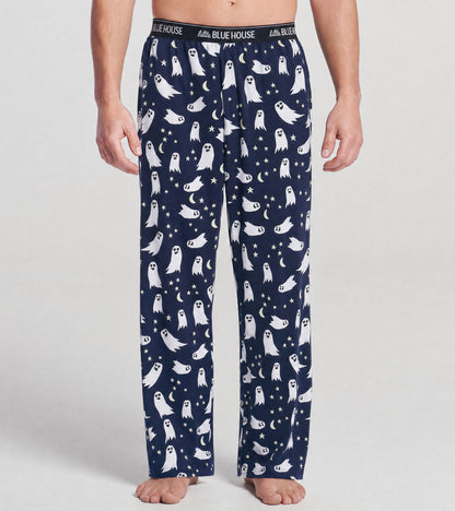 Front view of men's navy pajama pants with white ghosts, stars and crescent moons, and logo waistband