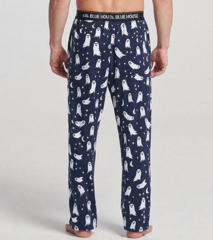 Back view of men's navy pajama pants with white ghosts, stars and crescent moons, and logo waistband