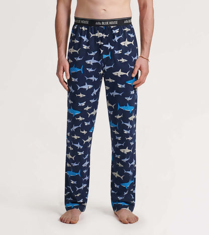 Men’s navy pajama pants with allover shark print and elastic waistband, front view on model