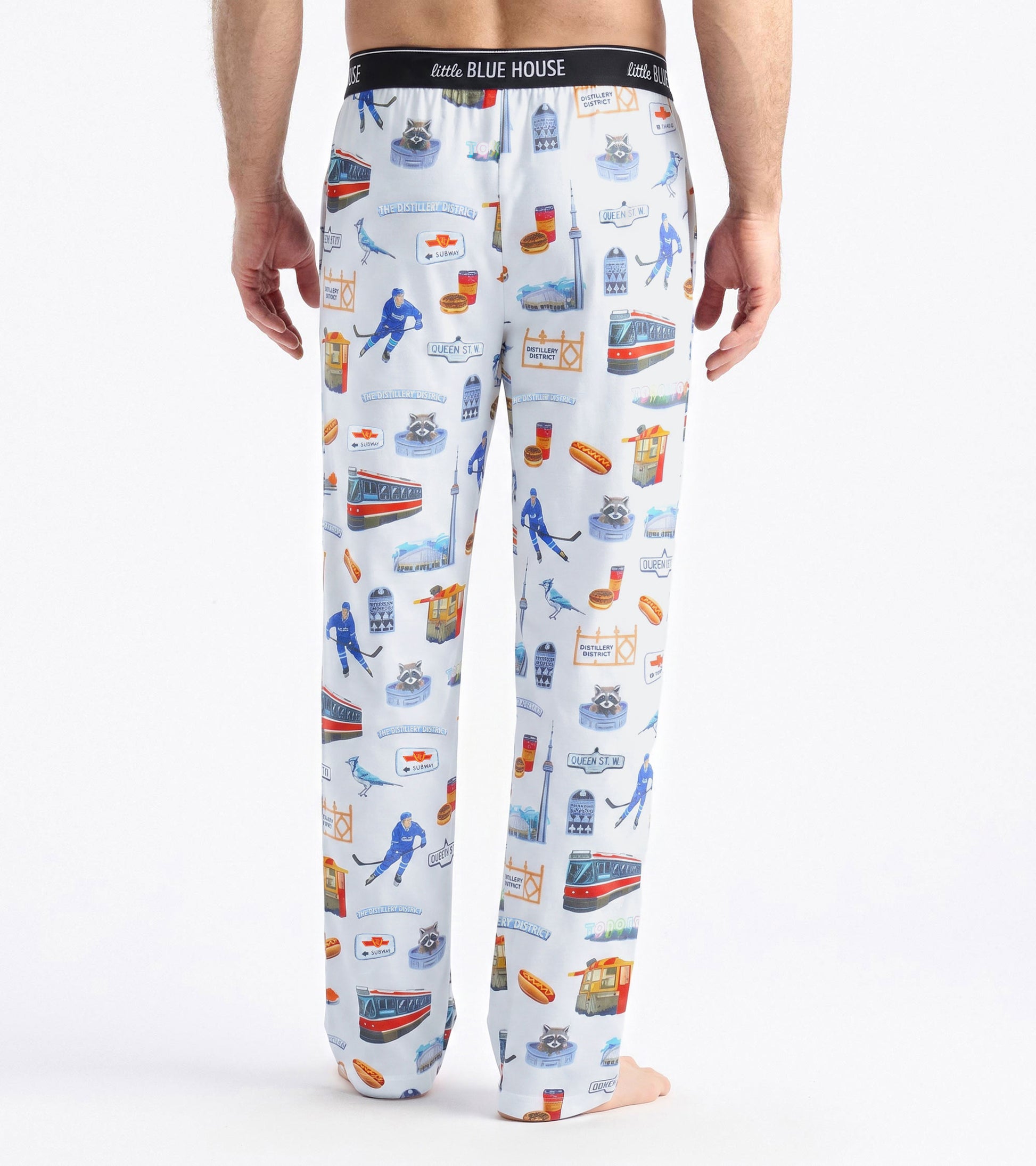 Back view of men's white pajama pants with Toronto print and black Little Blue House waistband