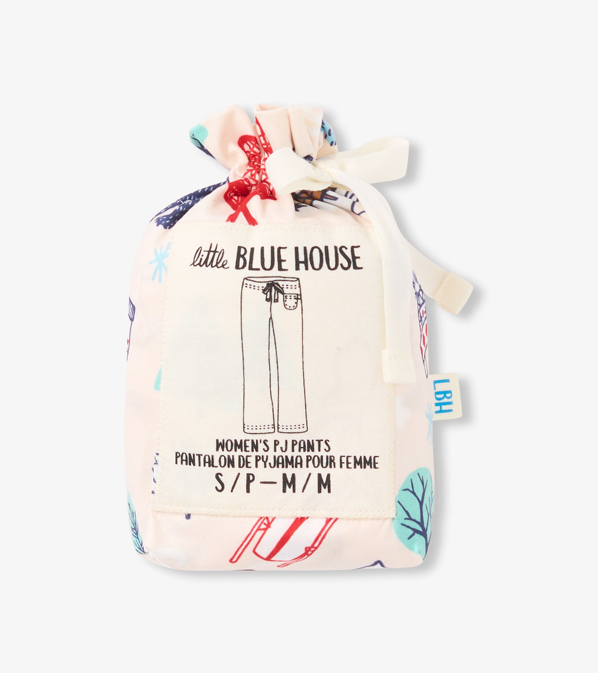 Drawstring pouch containing women's pajama pants with a colorful winter-themed print.