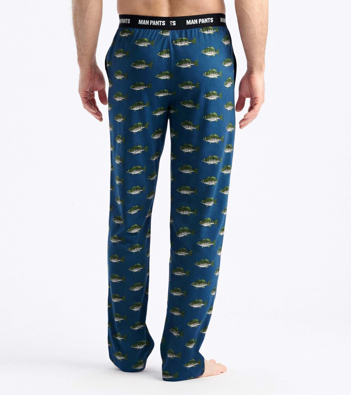 Back view of navy pajama pants with allover fish print and black elastic waistband