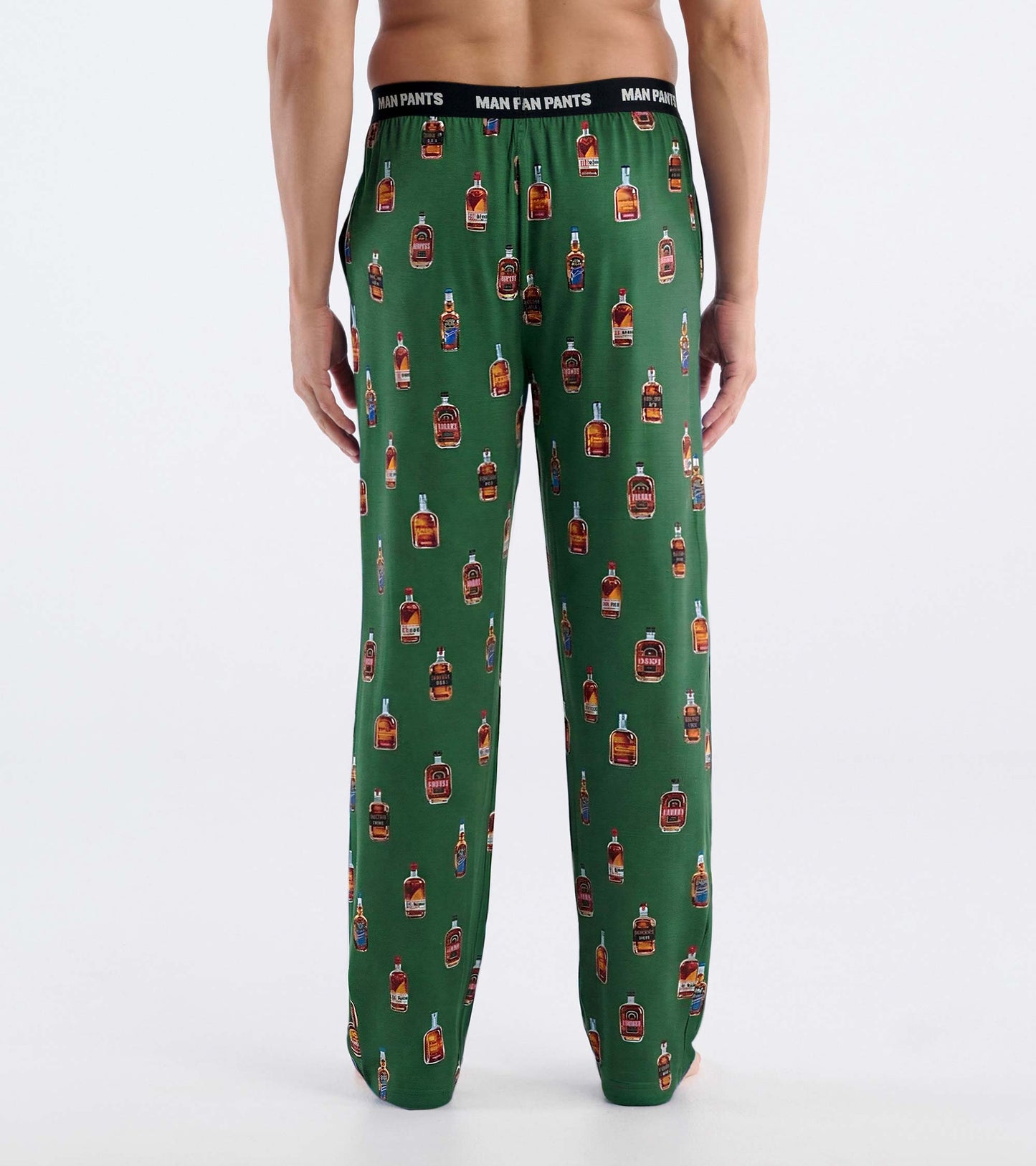 Back view of green pajama pants with bourbon bottle print and black elastic waistband