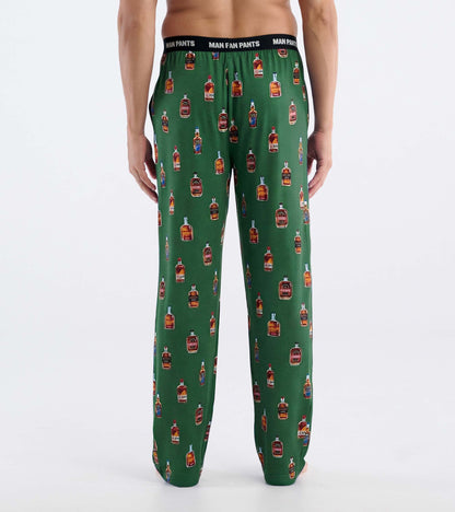 Back view of green pajama pants with bourbon bottle print and black elastic waistband