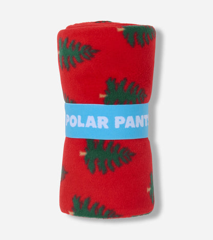 Red polar pants featuring a green tree pattern, rolled and secured with a blue band. Suitable for girls.