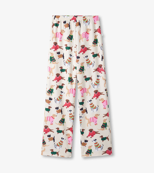 Cream-colored pants featuring a playful pattern of various dogs in colorful sweaters. Elastic waistband for comfort.