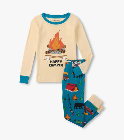 Kids cream long-sleeve pajama top with campfire graphic and blue patterned pants, laid flat