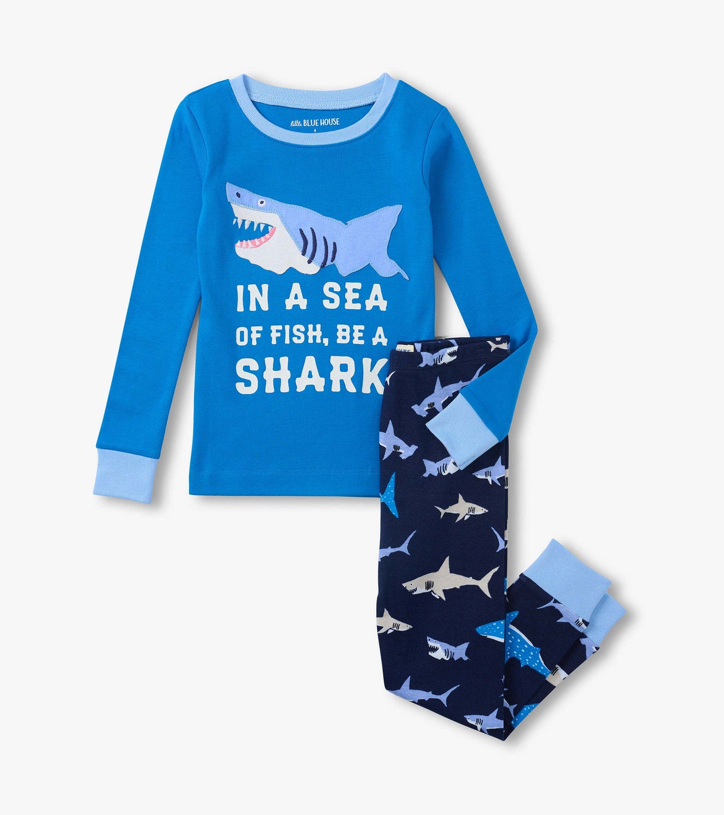 Blue kids pajama set with shark graphic top and navy shark-print pants, long sleeves, front view