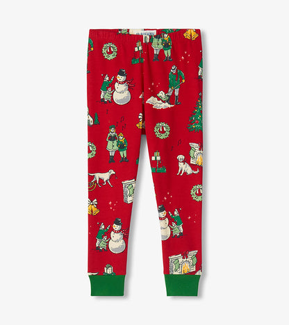 Red kids pajama pants with winter holiday print and green ankle cuffs