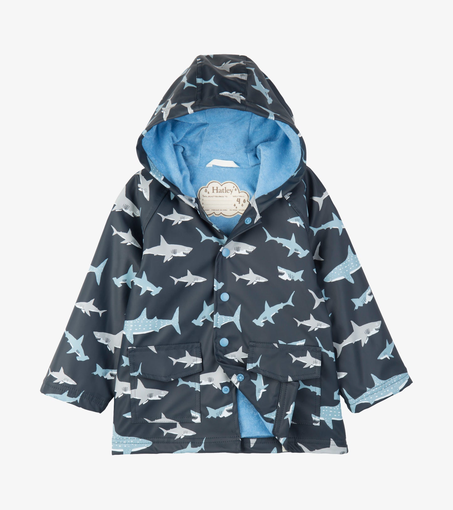 Kids hooded raincoat in dark blue with light blue and white shark print, front view