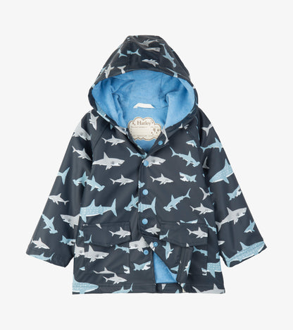 Kids hooded raincoat in dark blue with light blue and white shark print, front view