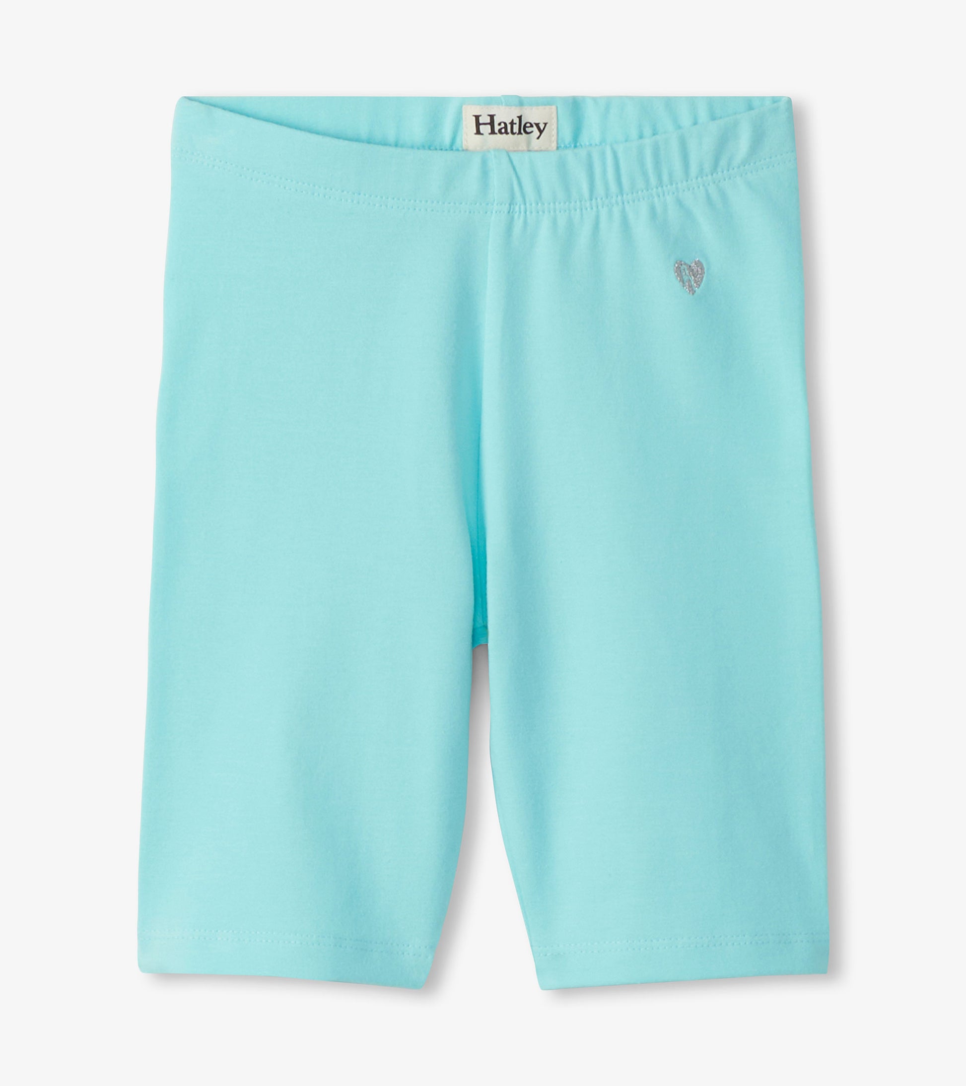 Light aqua girls bike shorts with a small heart detail, front view