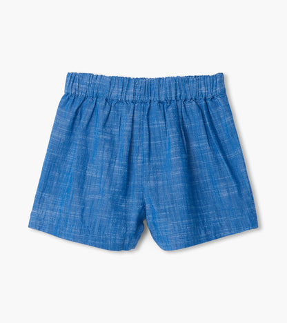 Blue chambray girls shorts with elastic paper bag waistband, front view