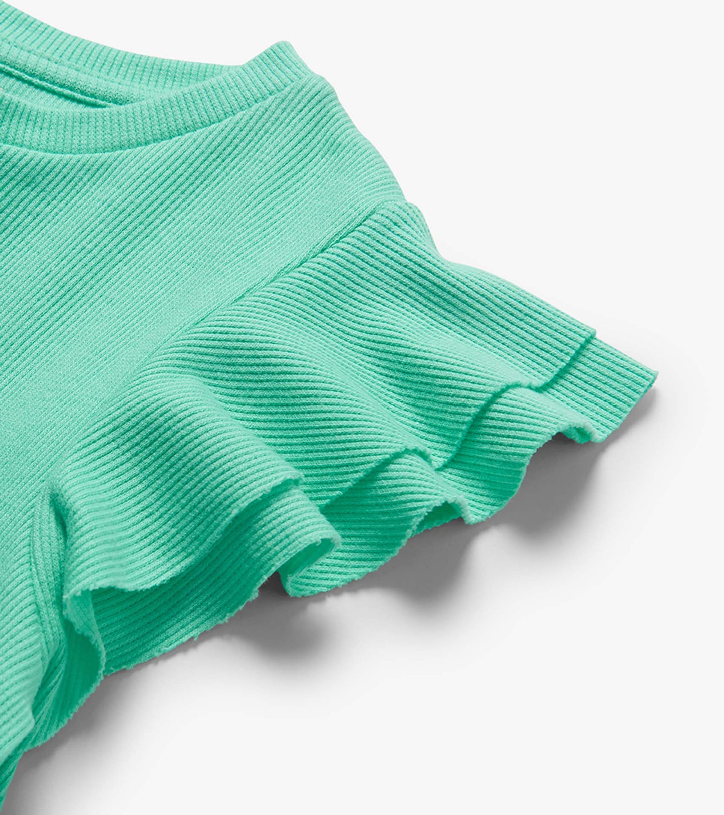 Mint green ribbed knit tank top with ruffled sleeves and hem, close-up detail view