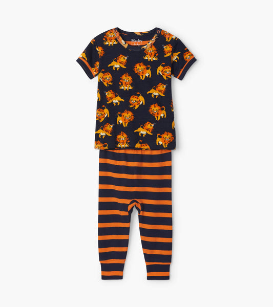 Navy organic cotton pajama set featuring a lion print top and orange striped pants, suitable for babies.