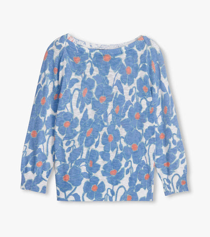 Flat lay of blue floral knit Breton top with boat neckline and long sleeves