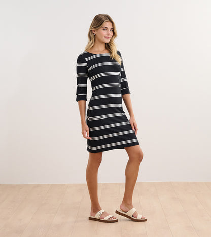Black and white striped dress with three-quarter sleeves, fitted silhouette, and round neckline.