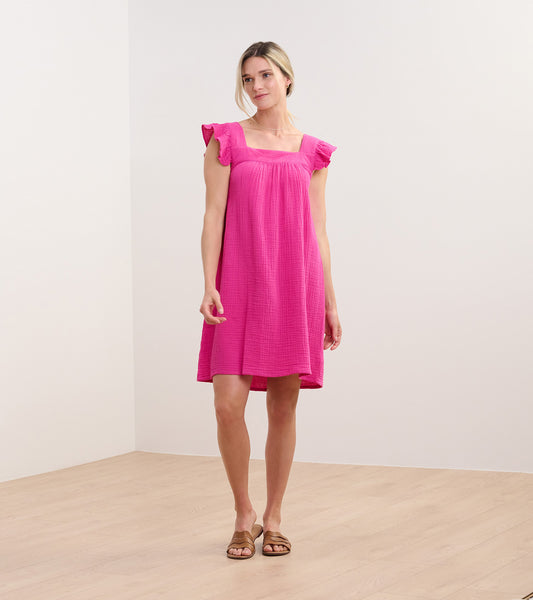 Fuchsia sleeveless dress with square neckline, flutter sleeves, and relaxed knee-length fit on model