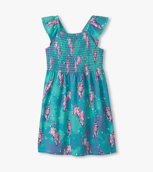Turquoise smocked dress with colorful tiger print and flutter sleeves, perfect for casual wear.