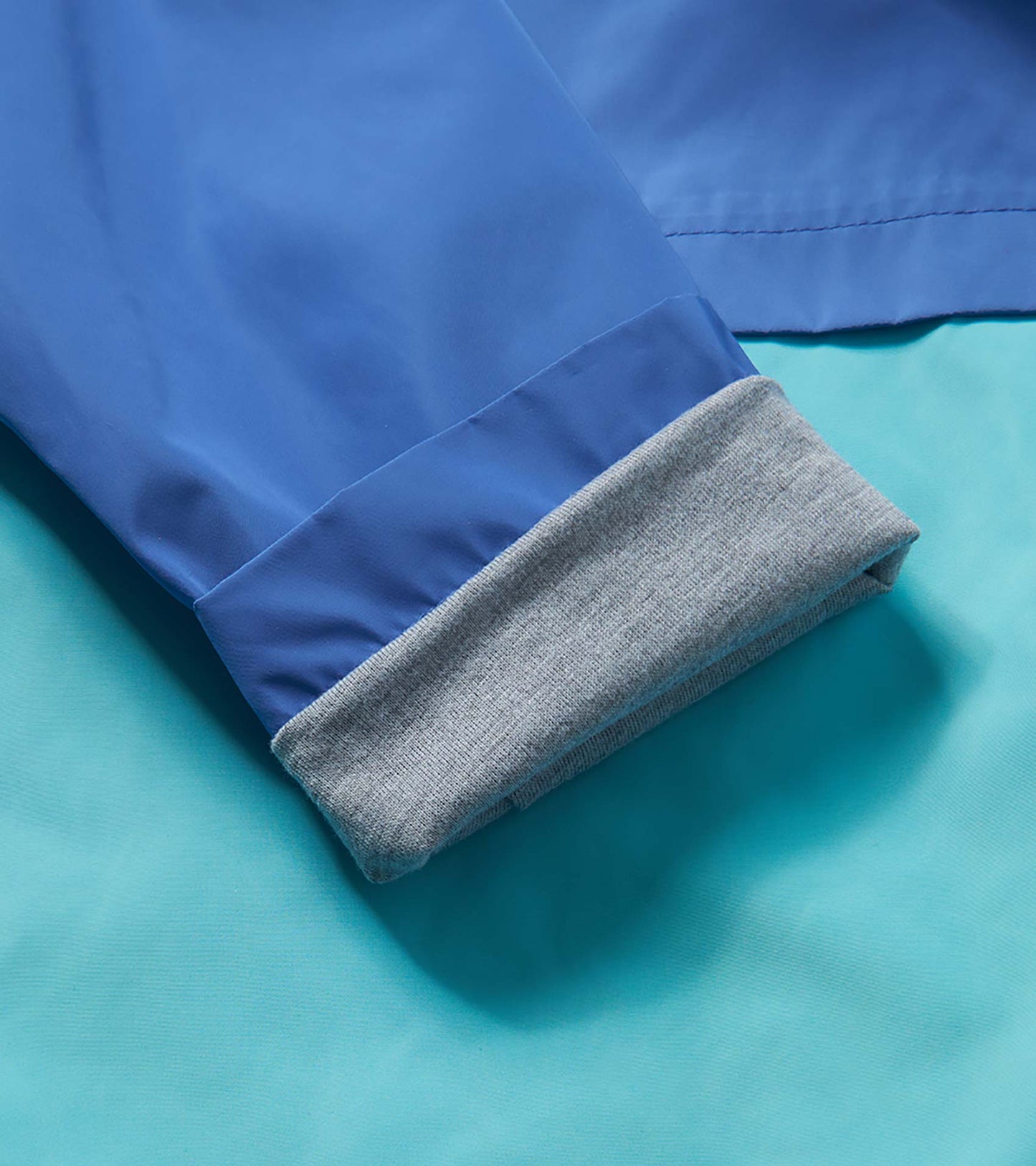 Veste de pluie doublée en jersey – Blocs de couleur bleus