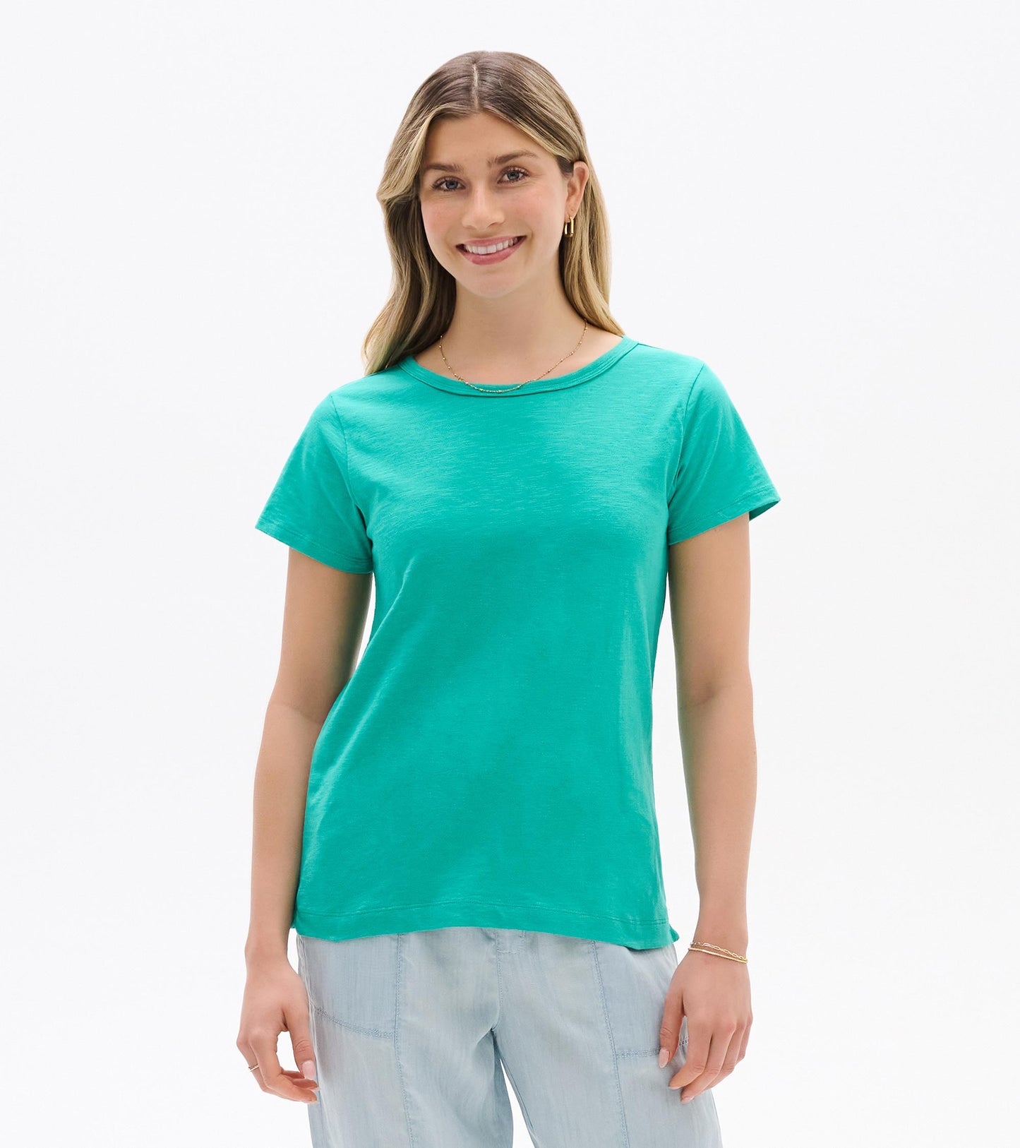Turquoise short-sleeve crew neck tee on a woman, front view, with a relaxed fit.