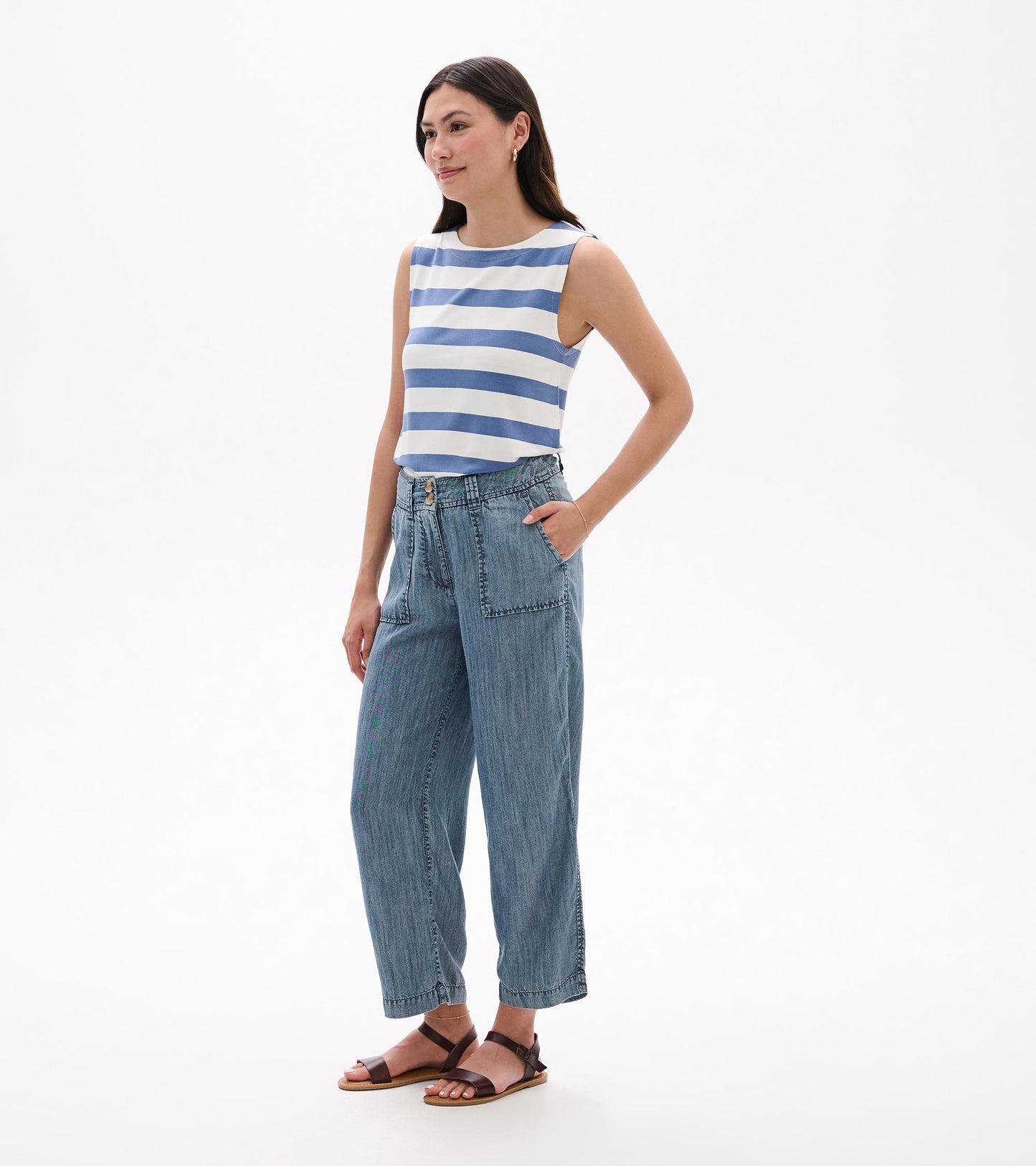 Blue acid wash wide-leg cropped jeans with front pockets, worn by a model in a front view.