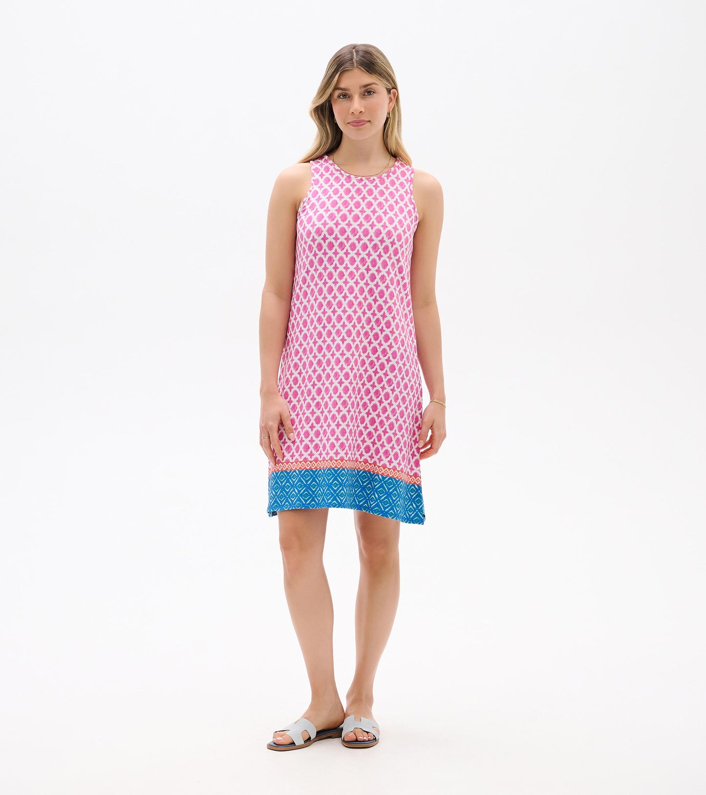 Sleeveless pink patterned shift dress with blue hem, front view