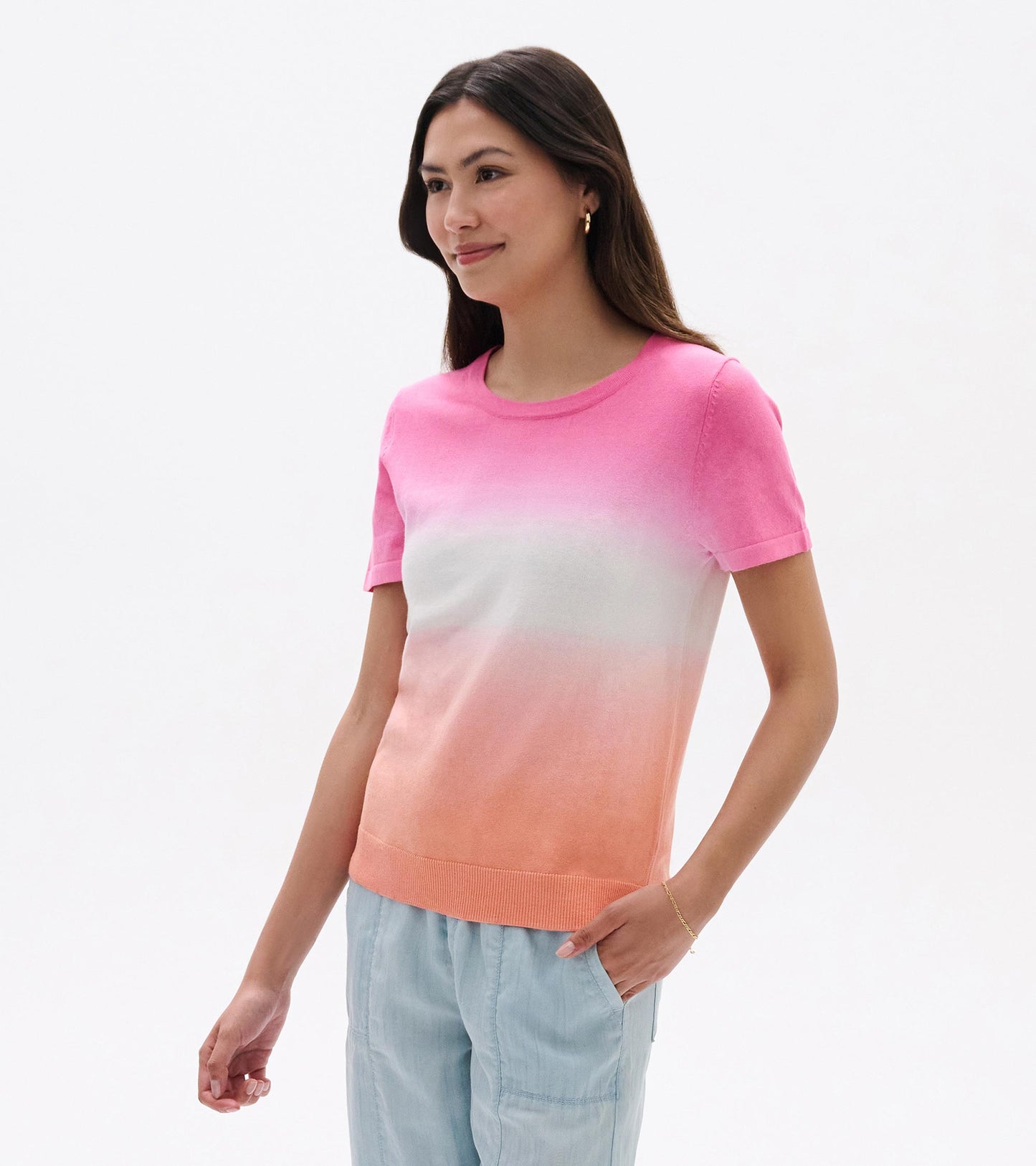 Pink-to-coral dip-dye knit tee with short sleeves and crew neck, shown on a model front view.