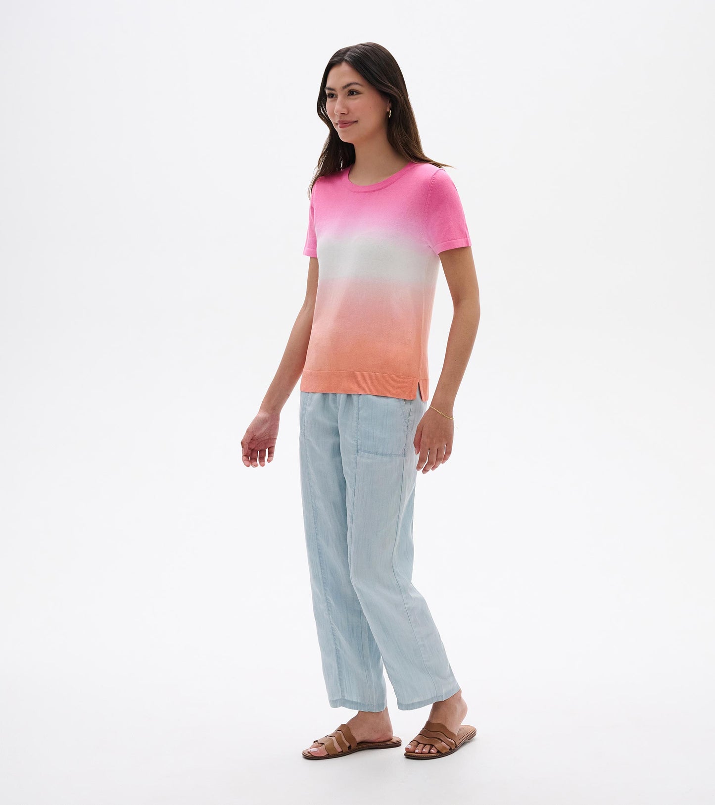 Short-sleeve knit tee with pink-to-coral dip-dye gradient and white center, front view on model
