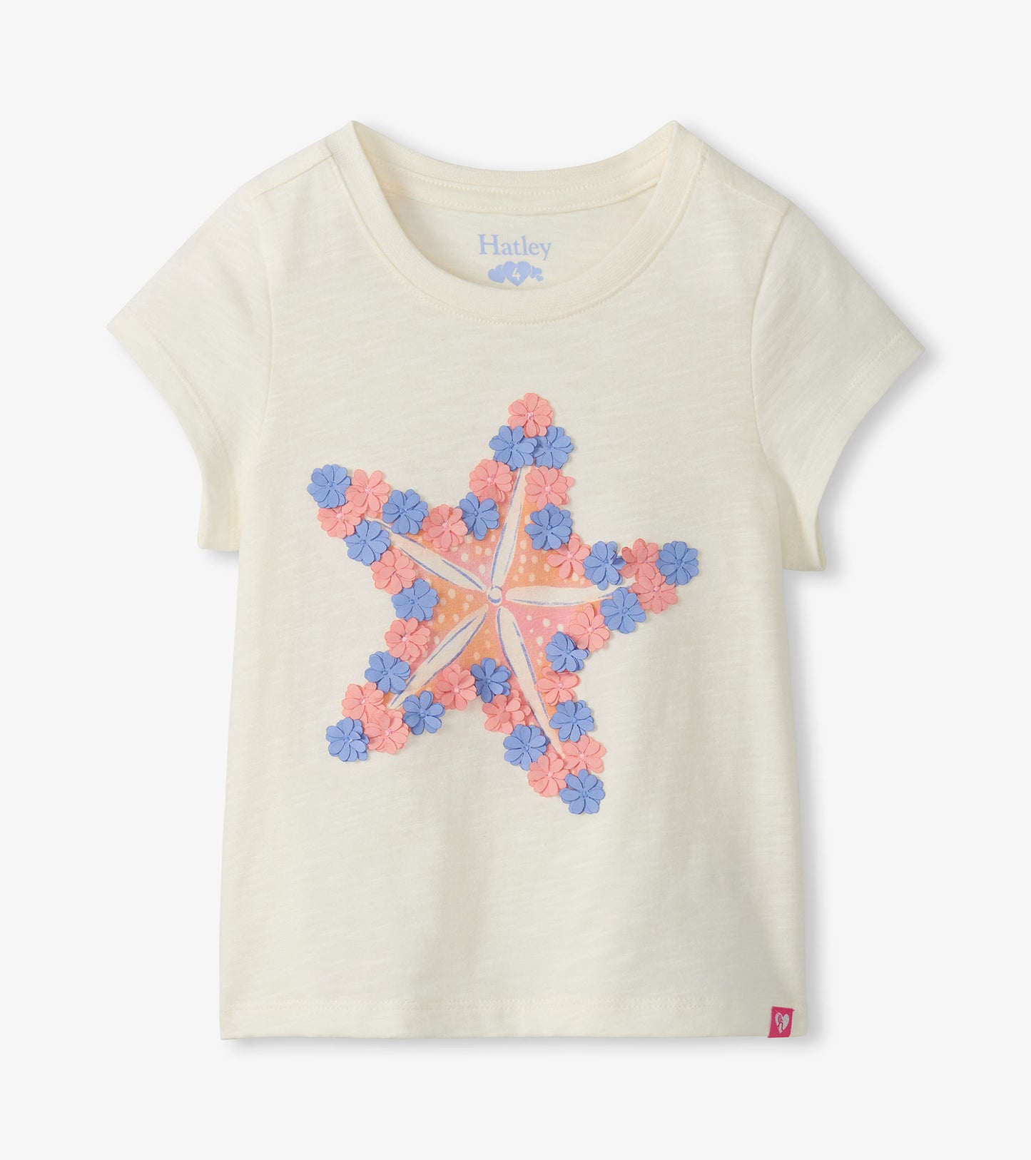 Cream short-sleeve girls tee with large pink and blue starfish graphic, front view