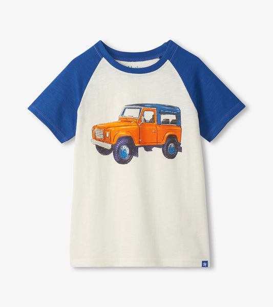 White and blue raglan boys T-shirt with orange off-road vehicle graphic on the front