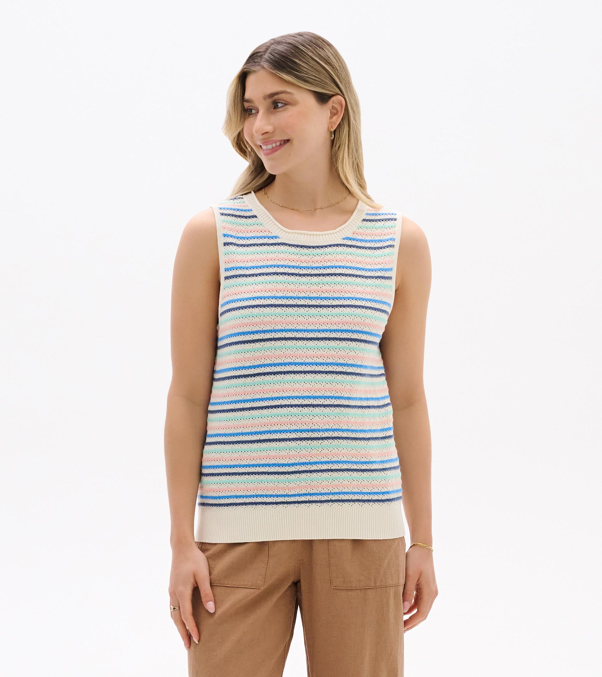 Sleeveless knit tank with cream base and blush, aqua, and blue stripes, shown from the front on a model