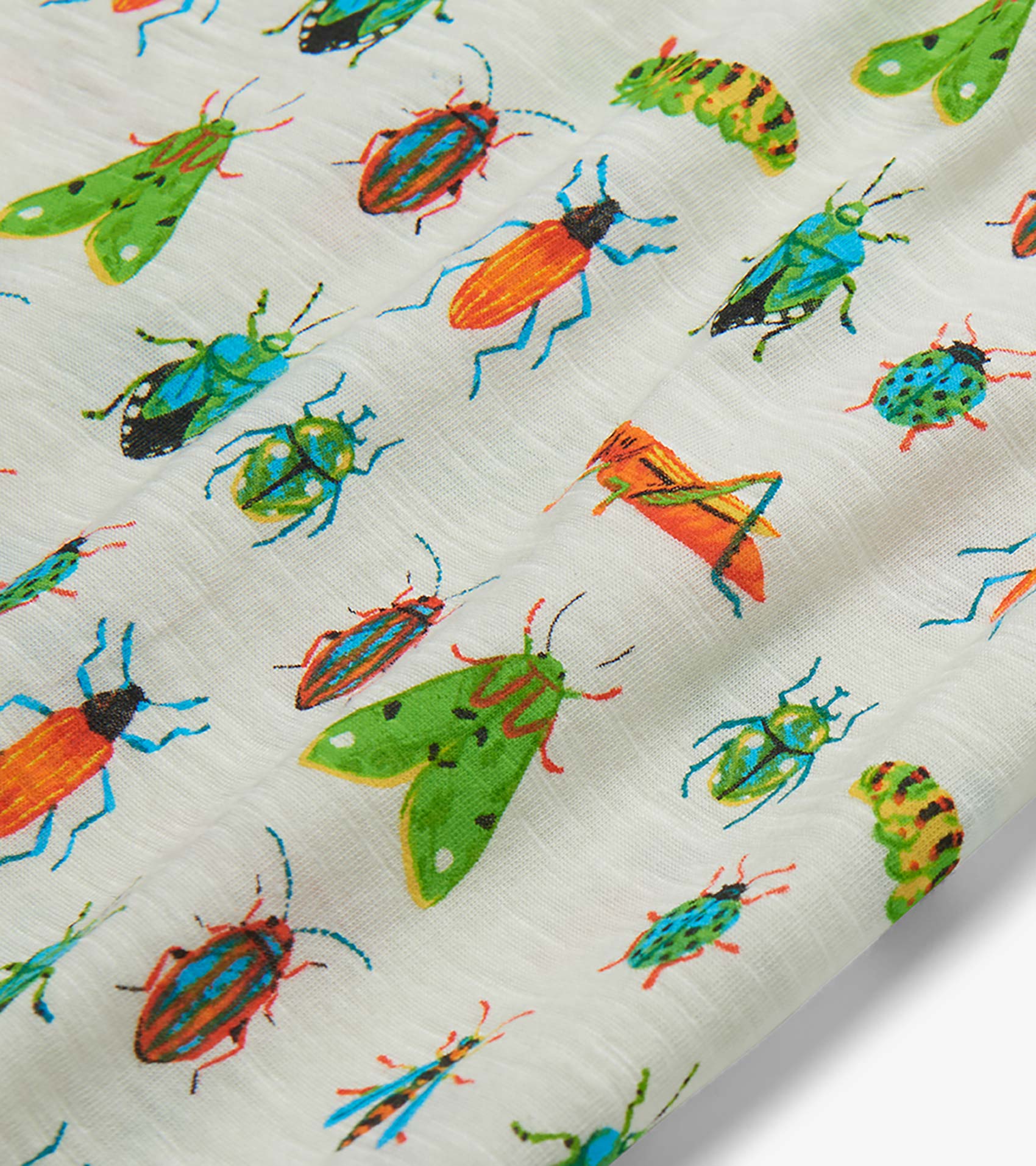 White T-shirt fabric with colorful insect print, including beetles, moths, and grasshoppers, close-up view