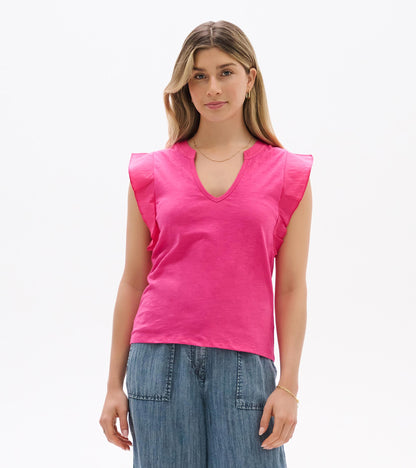 Bright pink sleeveless V-neck tank top with ruffled shoulders, shown front view on model