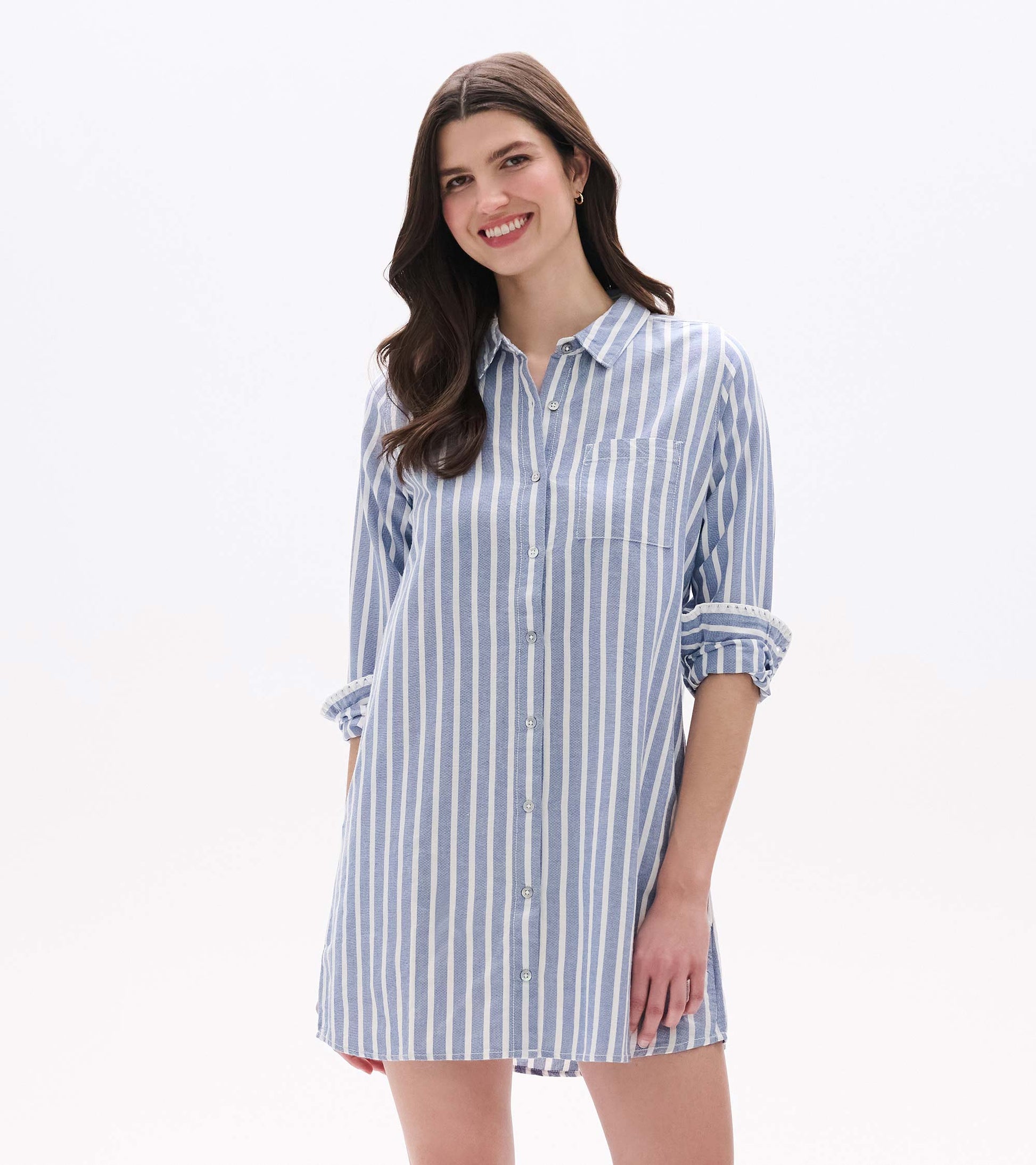 Front view of blue and white striped shirt dress with collar, chest pocket and rolled sleeves
