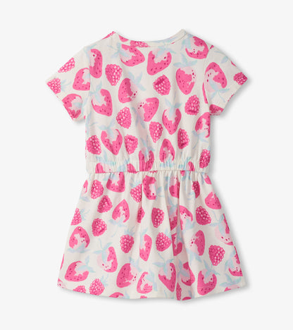 Short-sleeve girls' dress with white background and pink berry print, gathered waist, front view