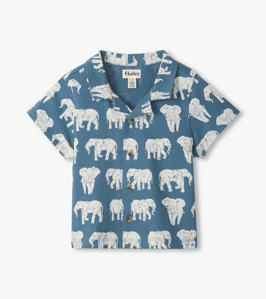 Blue short-sleeve button-down shirt with white elephant print, front view, collared neck and chest buttons