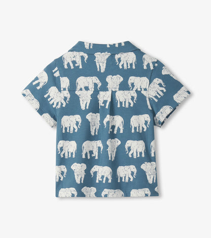 Blue short-sleeve button-down shirt with white elephant print, shown from the back